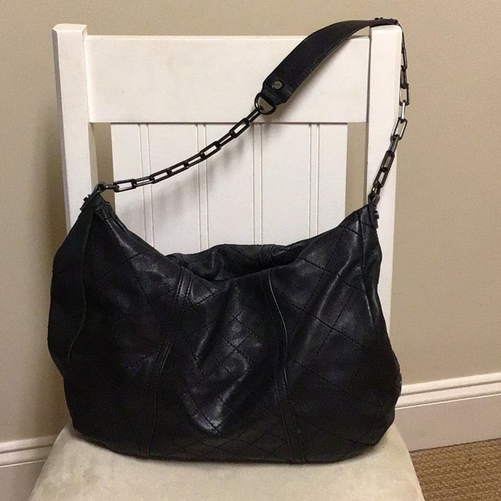 Tory Burch quilted leather purse with gun metal chain strap.